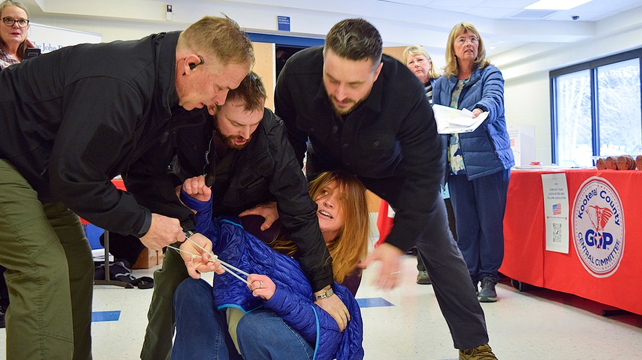 Private Security Guards Charged After Forcibly Removing Activist at Idaho Town Hall Meeting